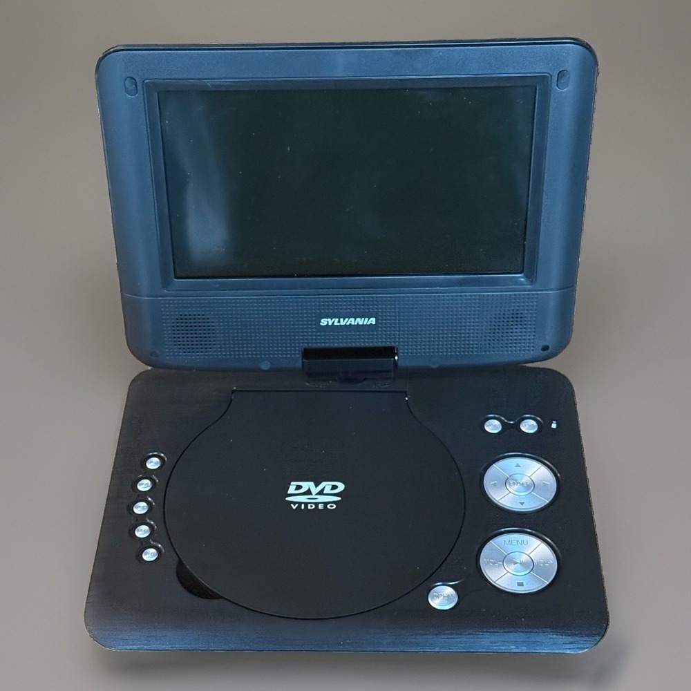 Sylvania SDVD7029 7" Portable DVD Player Tested Working No Charger Included